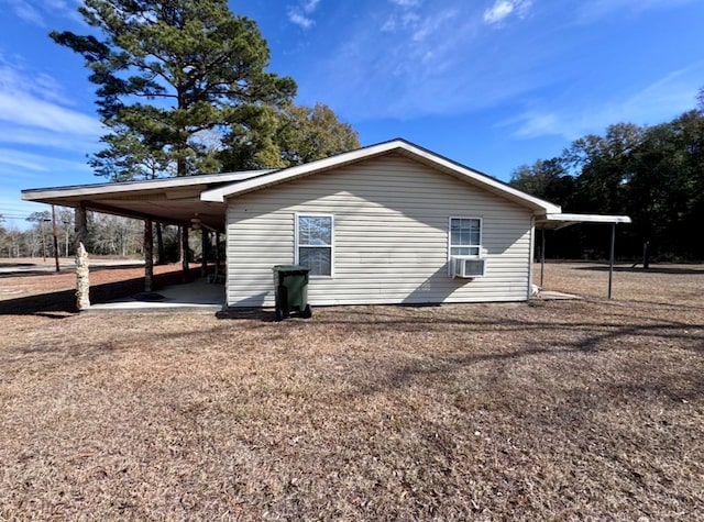 view of side of home with an attached carport and cooling unit