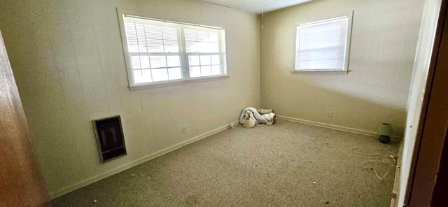 empty room featuring visible vents and baseboards