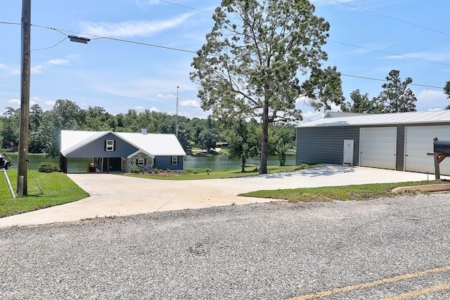 1272 Otho Rd, Abbeville, AL 36310 - view of grassy yard featuring driveway, an outdoor structure, a detached garage, and a carport