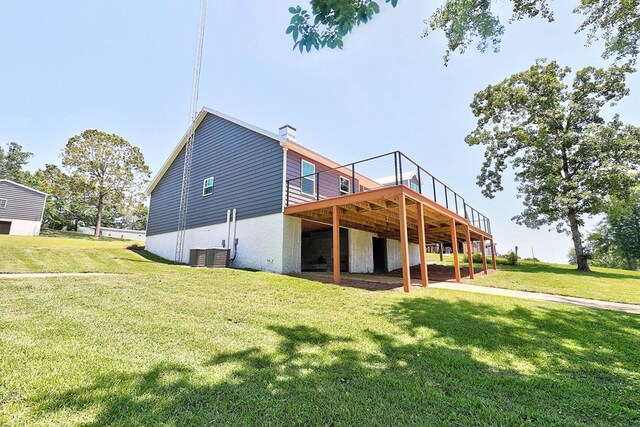 1272 Otho Rd, Abbeville, AL 36310 - back of property featuring a wooden deck, a yard, and a chimney