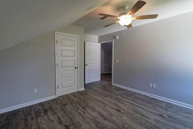 1272 Otho Rd, Abbeville, AL 36310 - unfurnished bedroom with dark wood-style floors, vaulted ceiling, and a ceiling fan