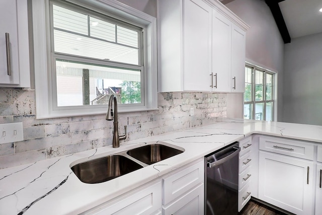 1272 Otho Rd, Abbeville, AL 36310 - kitchen featuring stainless steel dishwasher, white cabinetry, tasteful backsplash, beamed ceiling, and light stone countertops