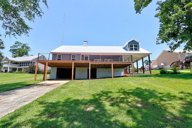 1272 Otho Rd, Abbeville, AL 36310 - view of front of property with concrete driveway, a wooden deck, a front lawn, a metal roof, and stairway