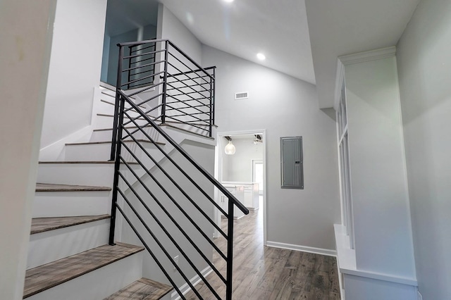 1272 Otho Rd, Abbeville, AL 36310 - stairway with electric panel, high vaulted ceiling, wood finished floors, and recessed lighting