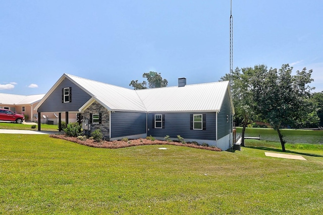 1272 Otho Rd, Abbeville, AL 36310 - view of front facade featuring a front yard, a metal roof, and a chimney