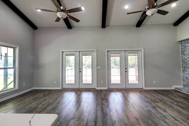 1272 Otho Rd, Abbeville, AL 36310 - unfurnished living room featuring french doors, a ceiling fan, beamed ceiling, plenty of natural light, and dark wood-style floors