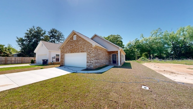 view of front of house featuring a garage, fence, a front lawn, brick siding, and concrete driveway
