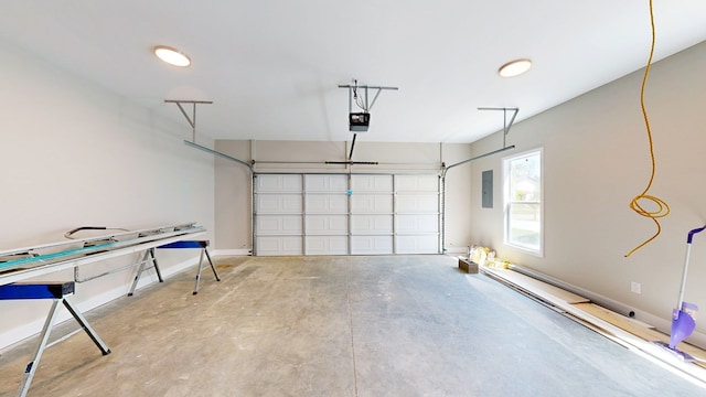 garage featuring electric panel, baseboards, and a garage door opener