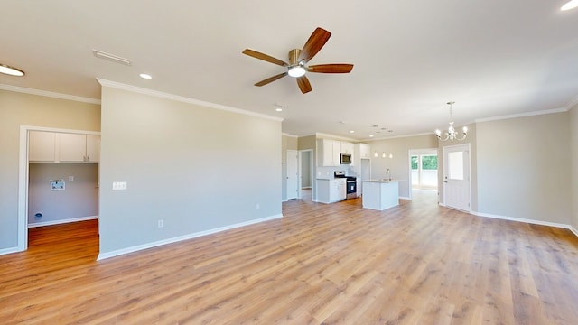 unfurnished living room with visible vents, baseboards, a sink, light wood finished floors, and ceiling fan with notable chandelier