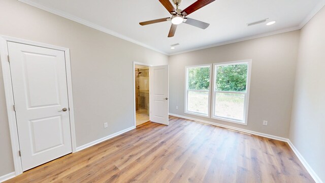 unfurnished bedroom with baseboards, visible vents, light wood-type flooring, and ornamental molding