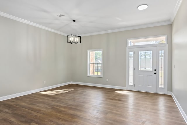 entryway featuring ornamental molding, visible vents, and dark wood-type flooring