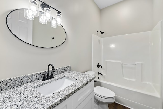 bathroom with shower / tub combination, vanity, and toilet