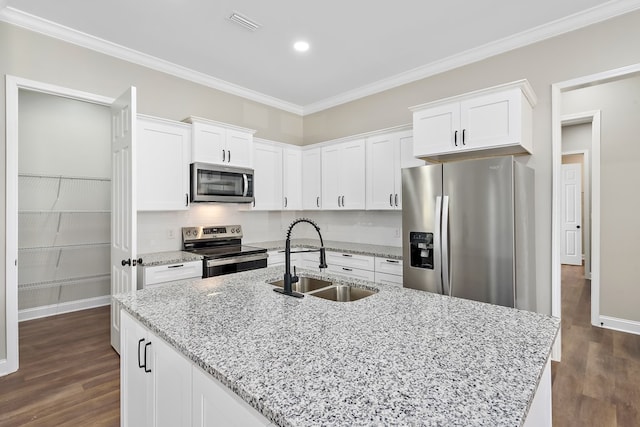 kitchen featuring crown molding, white cabinetry, stainless steel appliances, and a sink