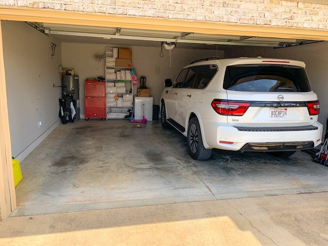 202 Moonlight Ln, Midland City, AL 36350 - garage featuring water heater and a garage door opener