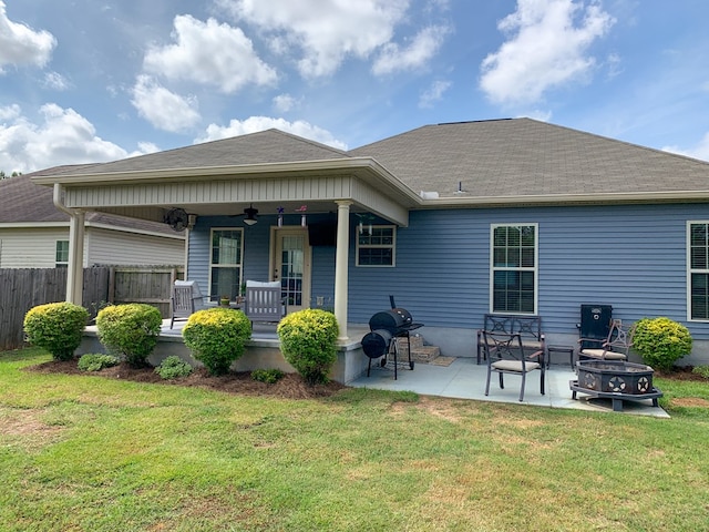 202 Moonlight Ln, Midland City, AL 36350 - back of property with a ceiling fan, a fire pit, covered porch, a patio area, and roof with shingles