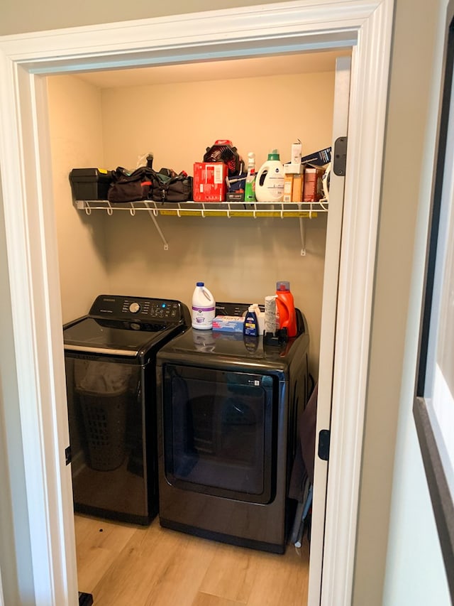 202 Moonlight Ln, Midland City, AL 36350 - laundry area with washer and clothes dryer and light wood-style flooring