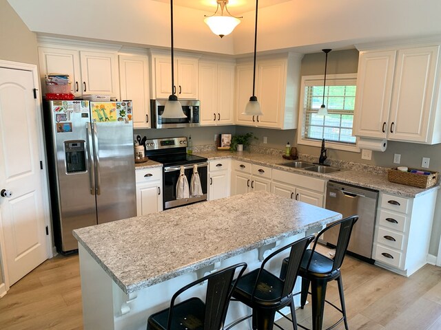 202 Moonlight Ln, Midland City, AL 36350 - kitchen featuring stainless steel appliances, light wood-type flooring, and white cabinetry