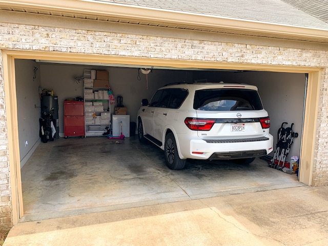 202 Moonlight Ln, Midland City, AL 36350 - garage with driveway and water heater