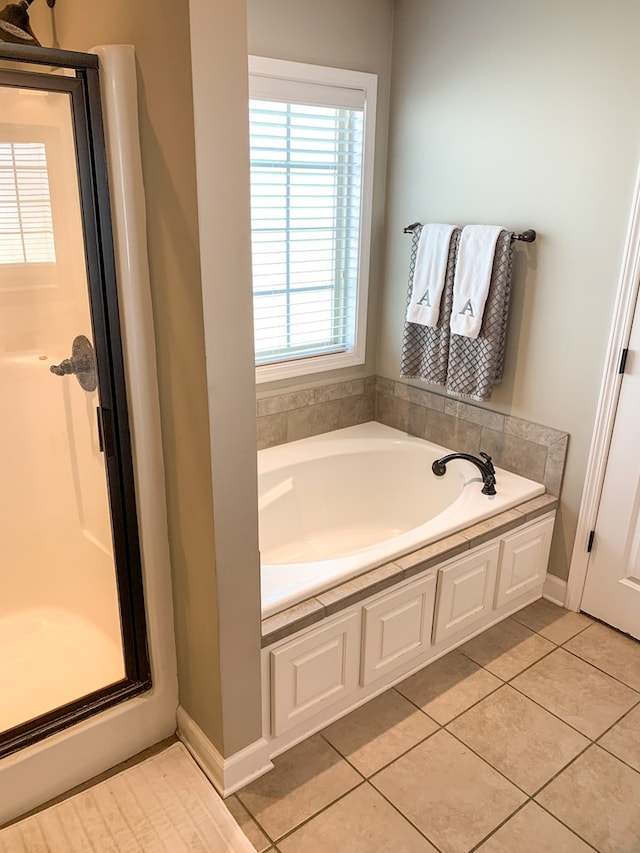 202 Moonlight Ln, Midland City, AL 36350 - bathroom with a garden tub, a stall shower, and tile patterned floors