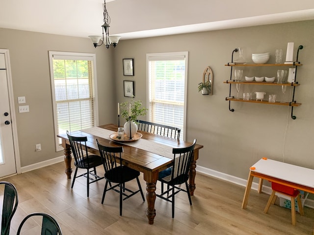202 Moonlight Ln, Midland City, AL 36350 - dining room with light wood-style flooring, plenty of natural light, and a chandelier