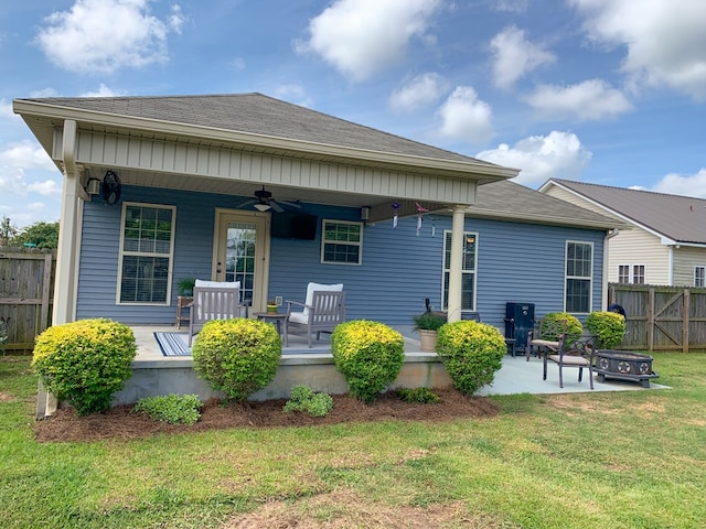 202 Moonlight Ln, Midland City, AL 36350 - rear view of property featuring an outdoor fire pit, a ceiling fan, roof with shingles, a patio area, and a porch