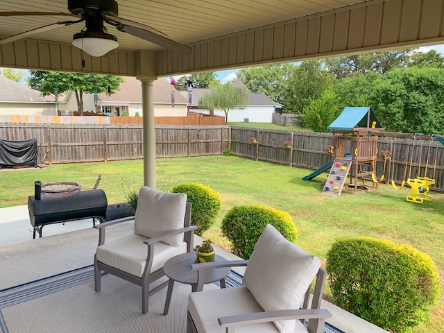 202 Moonlight Ln, Midland City, AL 36350 - fenced backyard featuring a playground, ceiling fan, and a patio