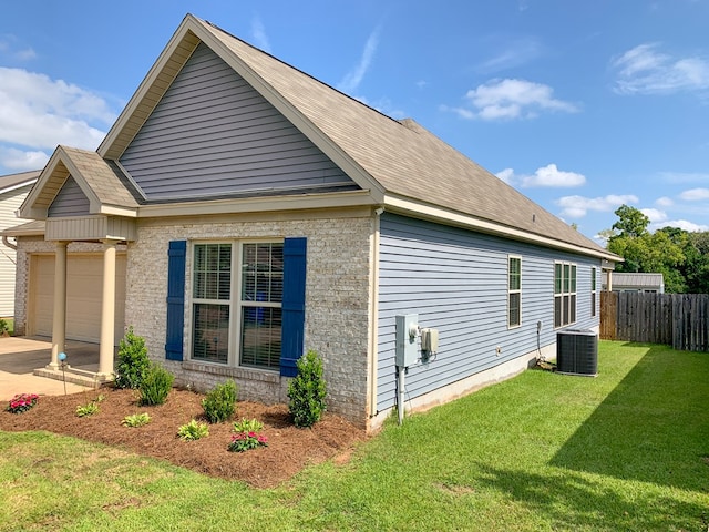 202 Moonlight Ln, Midland City, AL 36350 - view of home's exterior featuring a garage and a central air condition unit