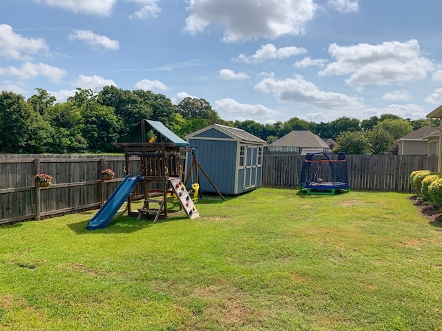 202 Moonlight Ln, Midland City, AL 36350 - fenced backyard with a storage shed and a playground