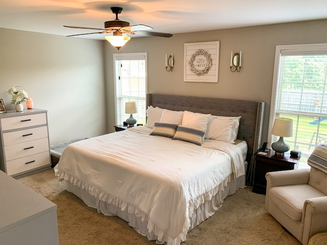 202 Moonlight Ln, Midland City, AL 36350 - bedroom featuring multiple windows, light colored carpet, and ceiling fan