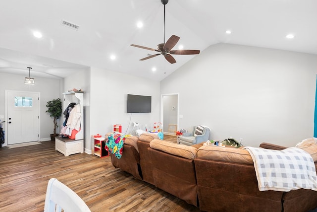 living area with ceiling fan, recessed lighting, wood finished floors, visible vents, and vaulted ceiling
