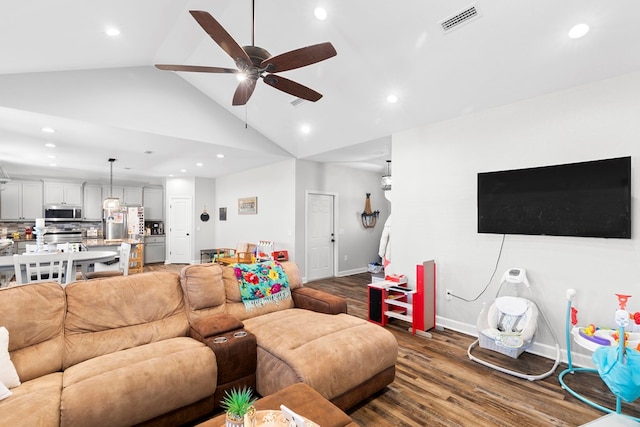 living room with a ceiling fan, wood finished floors, visible vents, and recessed lighting