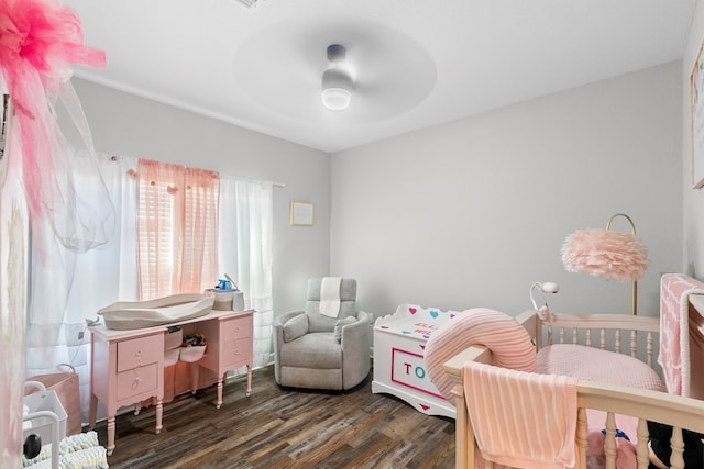 bedroom with dark wood finished floors and a ceiling fan