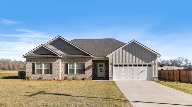 view of front facade with brick siding, concrete driveway, an attached garage, fence, and a front lawn