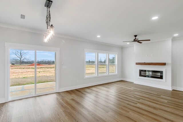 unfurnished room featuring ceiling fan, dark hardwood / wood-style flooring, and ornamental molding