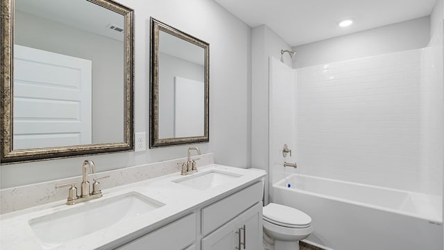 full bathroom featuring vanity, shower / bathtub combination, and toilet