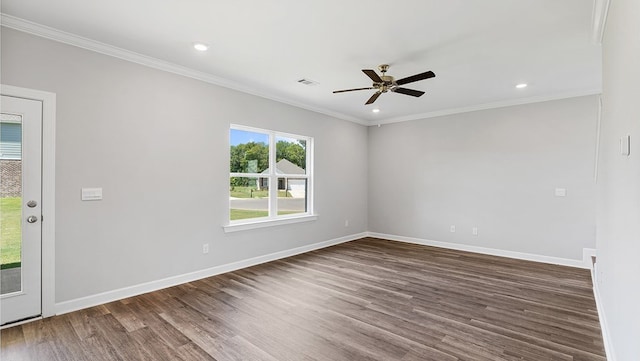 empty room featuring dark hardwood / wood-style flooring, ceiling fan, and crown molding