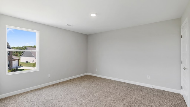 empty room with carpet flooring