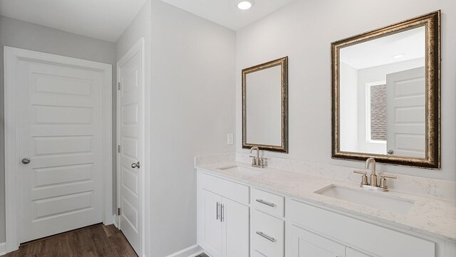 bathroom featuring vanity and wood-type flooring