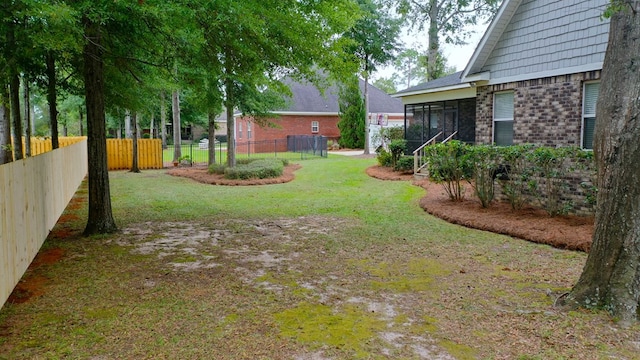 view of yard with a sunroom