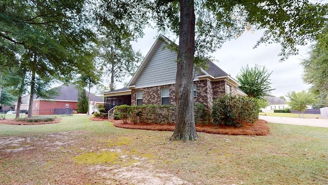 view of home's exterior featuring a yard