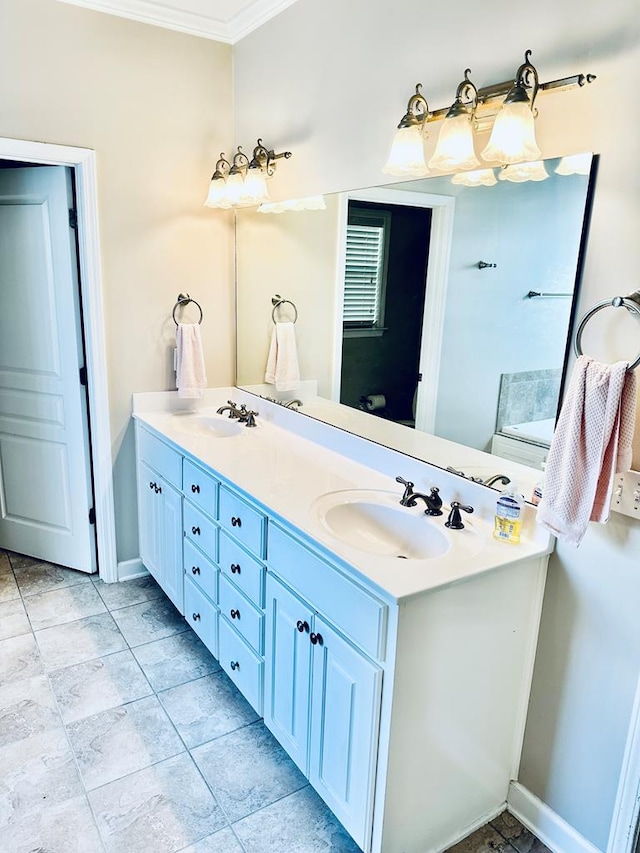 bathroom with crown molding and vanity