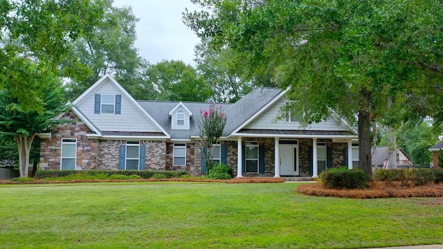 view of front of property with a porch and a front yard