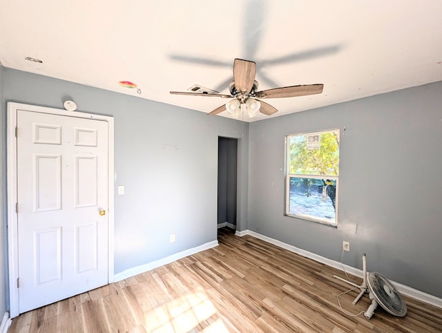 unfurnished room featuring ceiling fan and light hardwood / wood-style floors