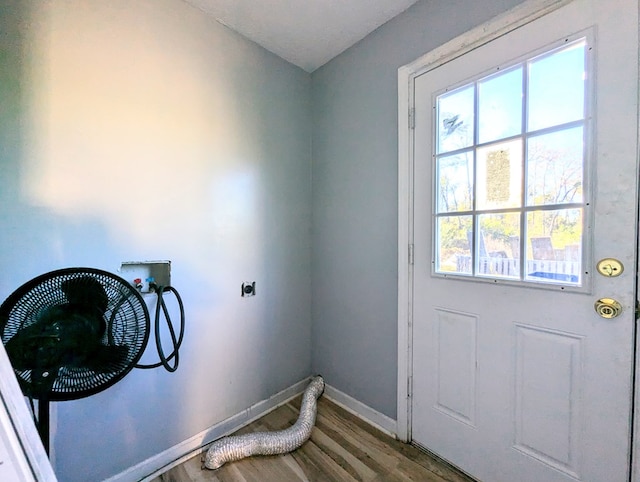 clothes washing area featuring hardwood / wood-style floors, electric dryer hookup, and washer hookup