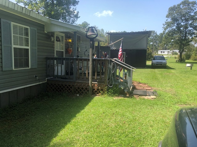 view of yard with a deck