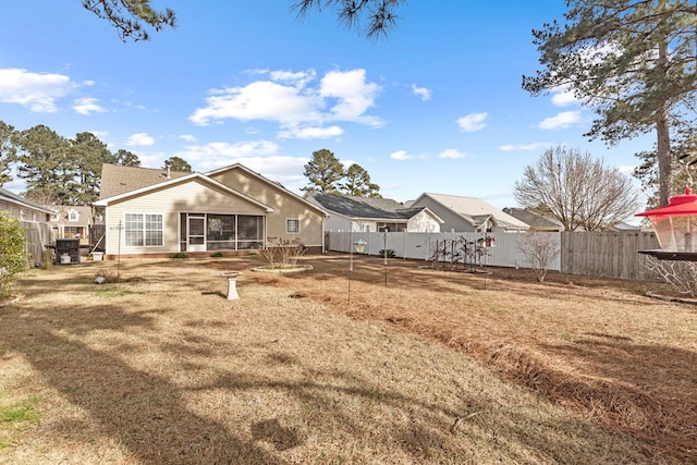 rear view of property with a yard