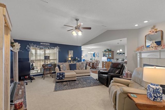 carpeted living room featuring a textured ceiling, lofted ceiling, and ceiling fan with notable chandelier