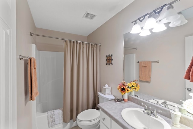 full bathroom featuring shower / tub combo with curtain, vanity, and toilet