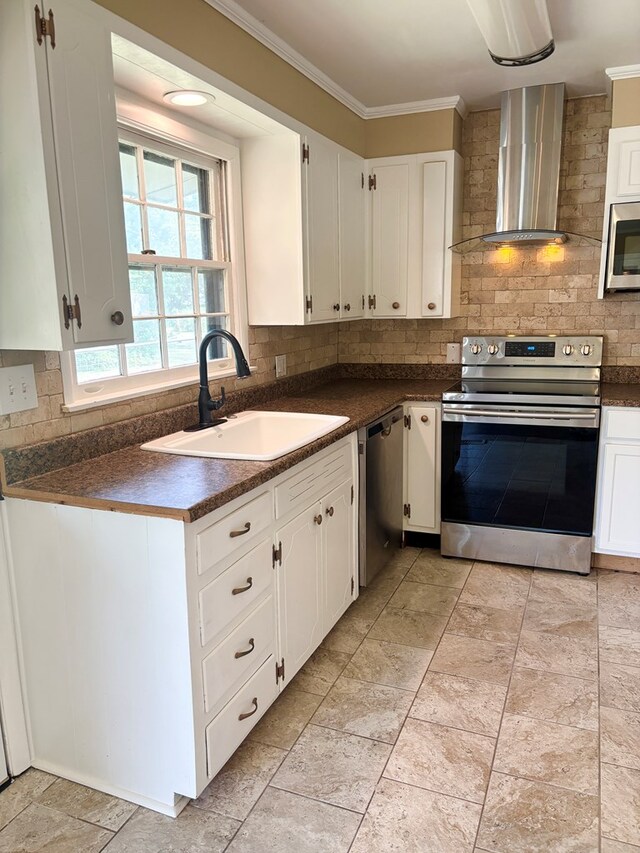 2203 Stonebridge Rd, Dothan, AL 36301 - kitchen with stainless steel appliances, wall chimney exhaust hood, a sink, dark countertops, and decorative backsplash