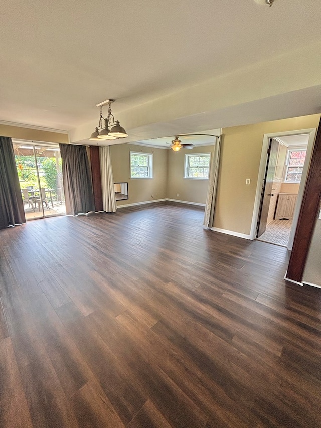 2203 Stonebridge Rd, Dothan, AL 36301 - unfurnished living room featuring dark wood-style floors, baseboards, and a ceiling fan